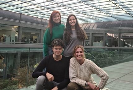 Chiara Ambrogio and her team standing in their institute in Turin 