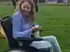 Eilidh Mackay enjoys the Teenage Cancer Trust day out, she sitting in a park and laughing 